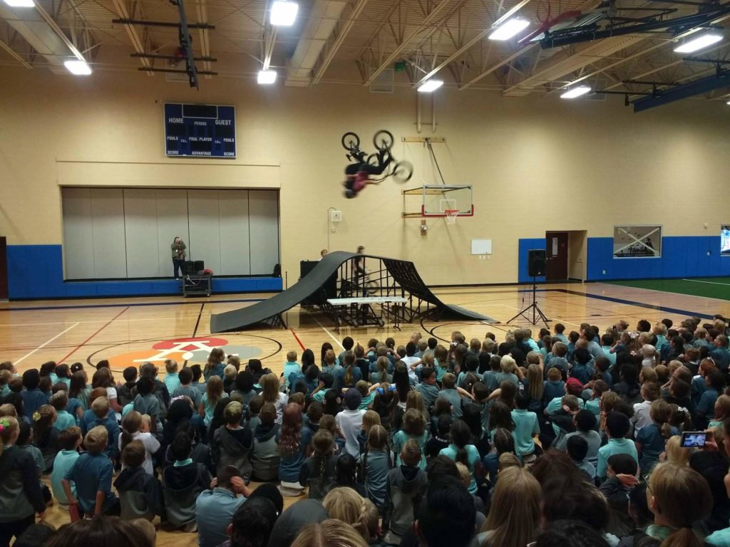 5050BMX bike tricks at bullying prevention assembly